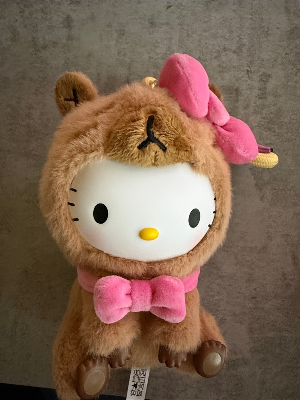 Sanrio Hello Kitty Plush in Brown Bear Outfit with Pink Bow Accents